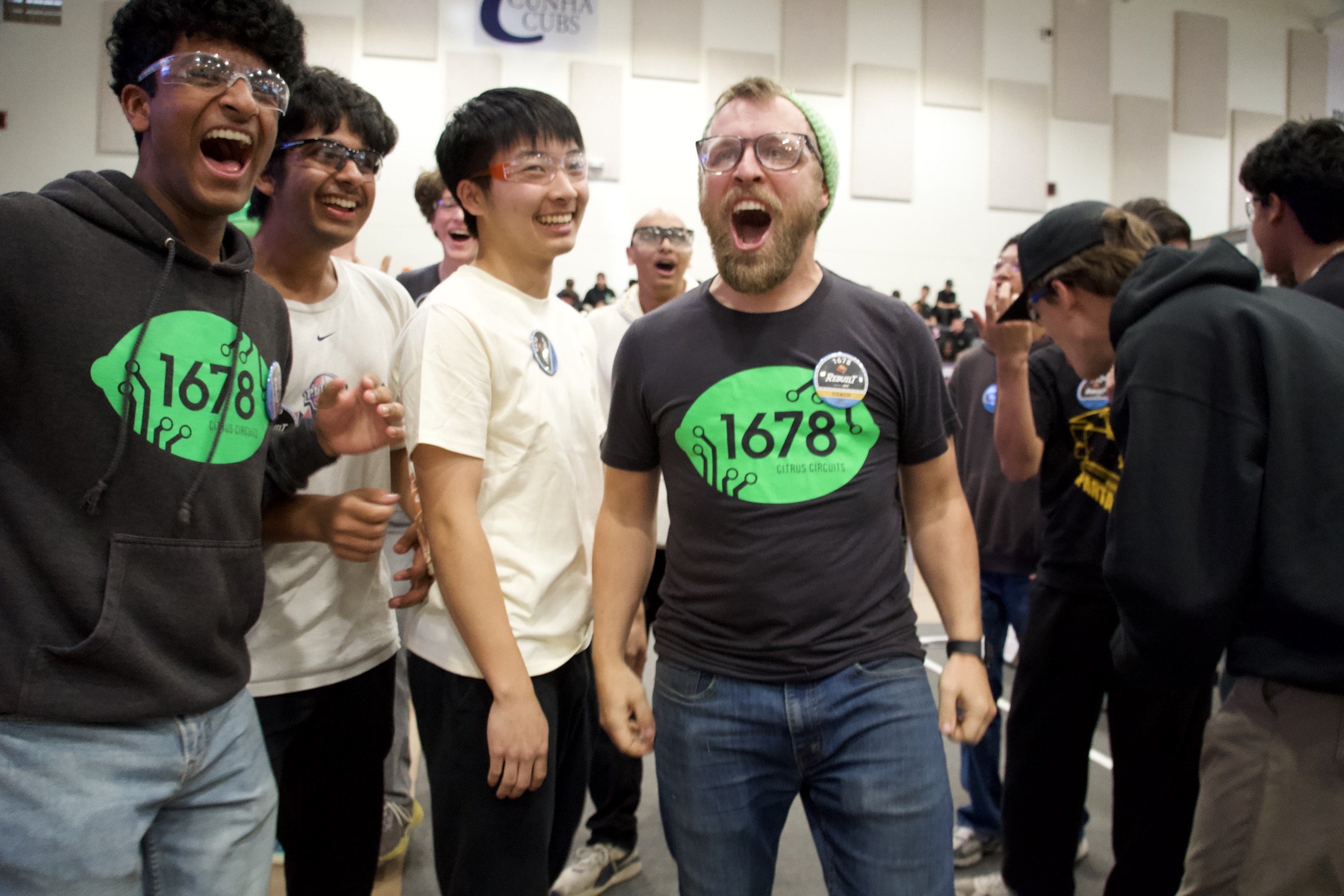 Team members celebrating with Citrus Circuits at a competition
