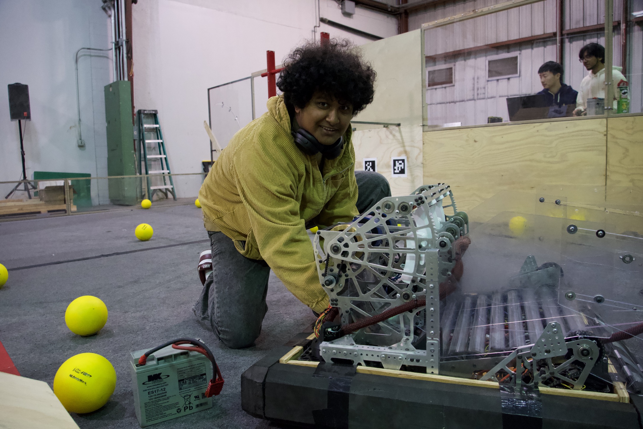 Team member working on the robot on a practice field