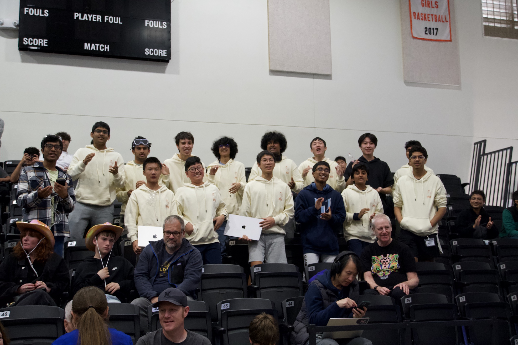 Team members cheering from the competition stands