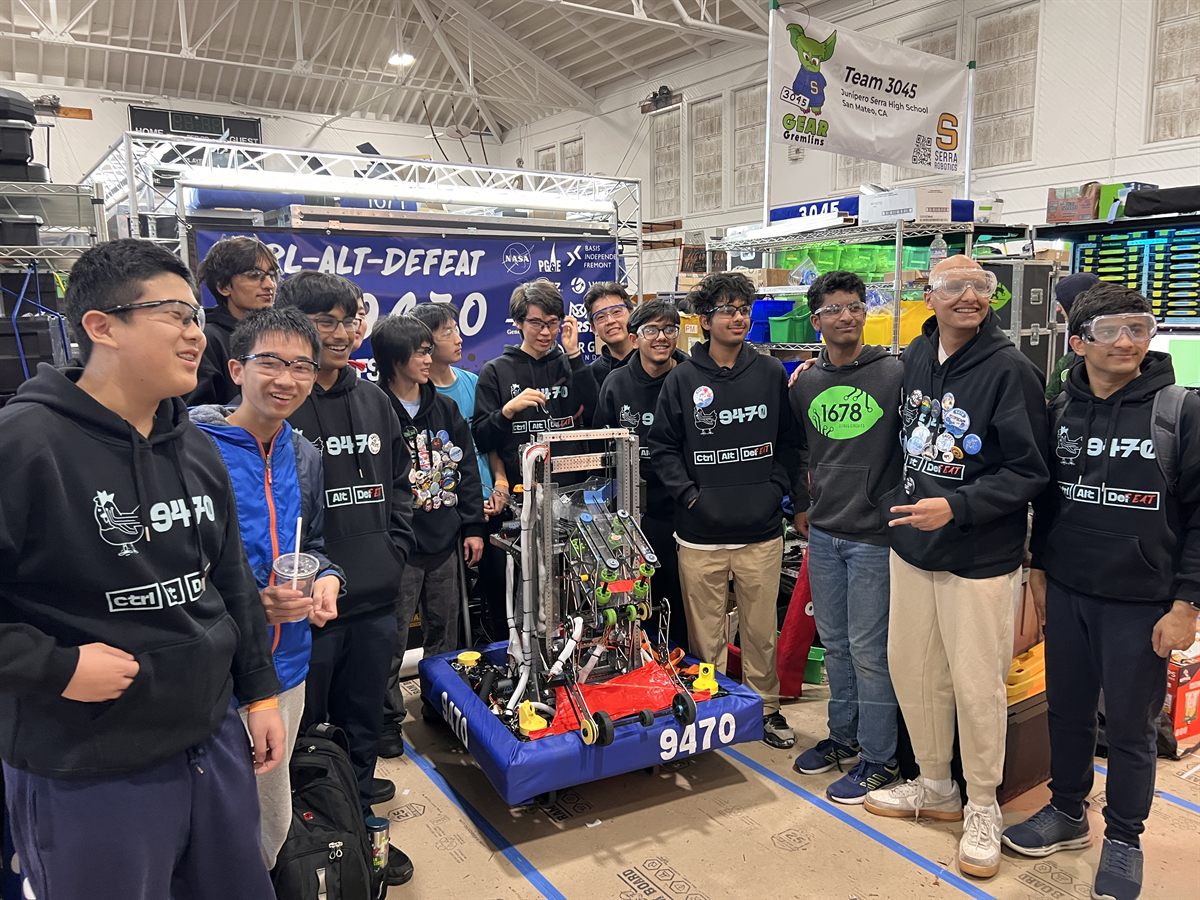 Team members representing Ctrl-Alt-Defeat at an outreach event