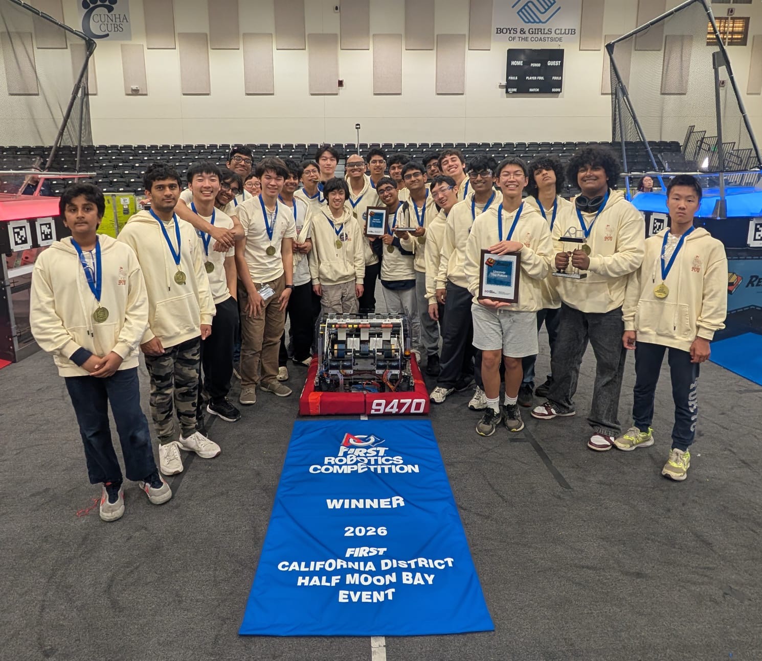 Team 9470 with robot and Winner banner at Half Moon Bay