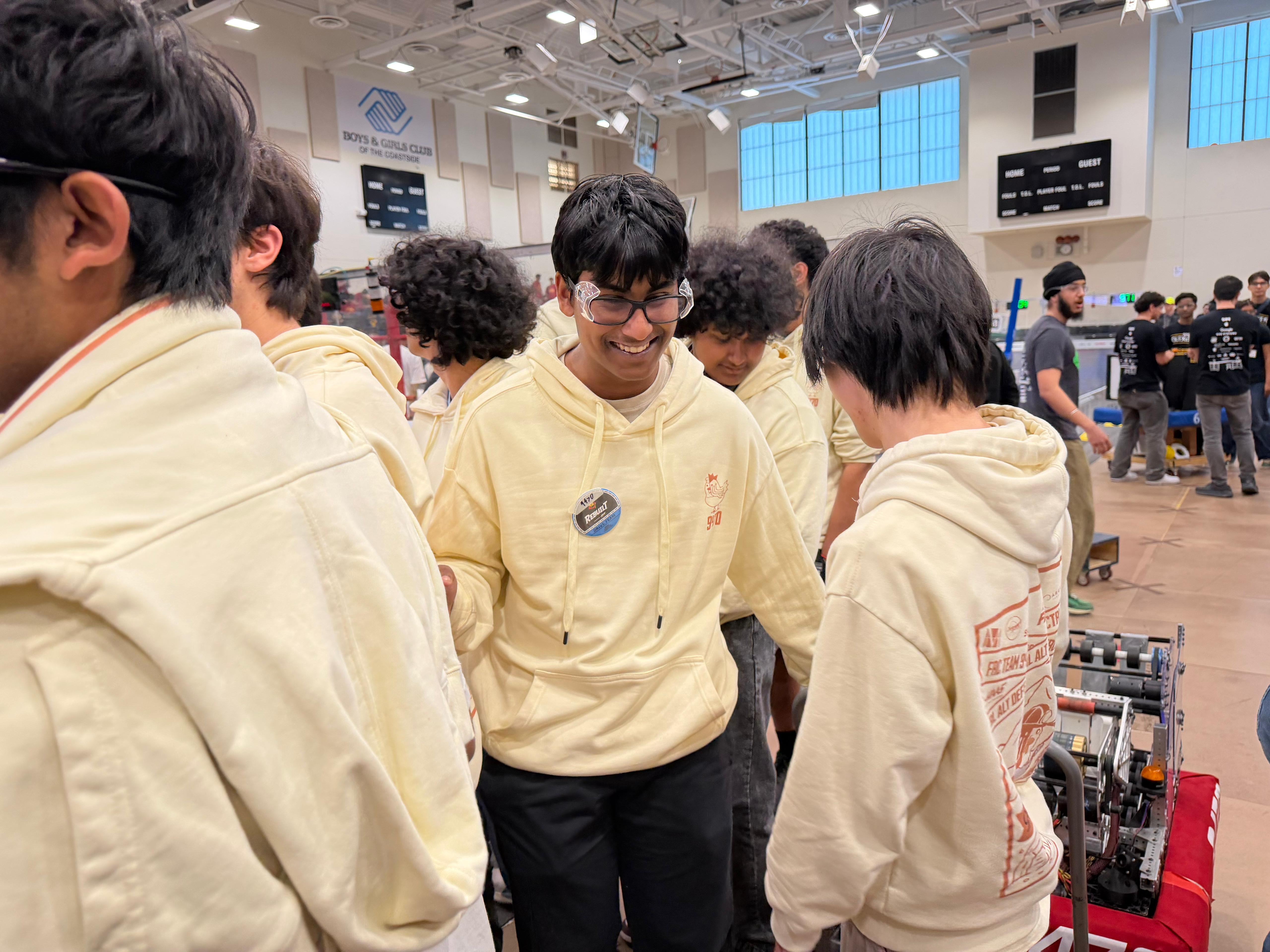 Team members huddling in the pit