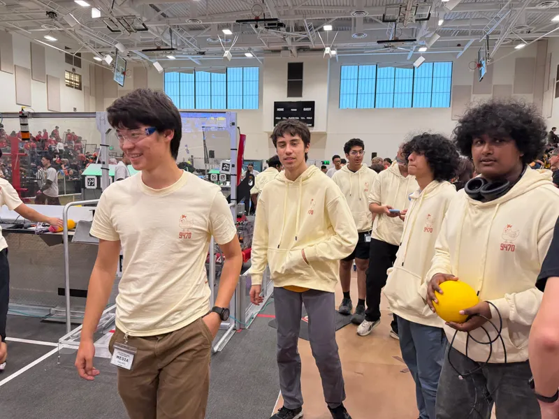 Team 9470 members walking near the competition field